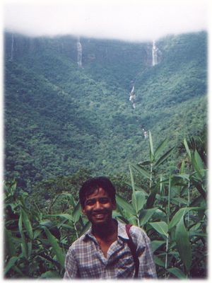 photo of Joel with waterfalls in the background