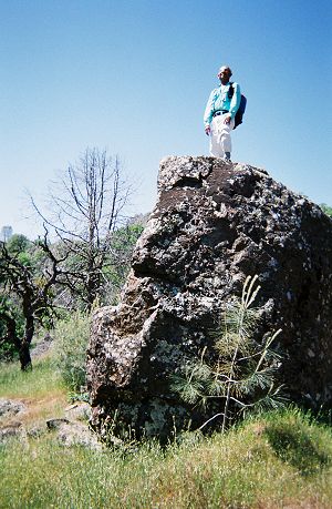 Dinesh atop a large rock
