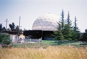 a large white dome next to the trail