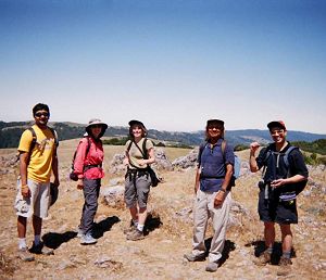 five hikers on the mountain's wide summit