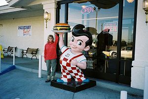 Joy helping the Big Boy statue hold a cheeseburger