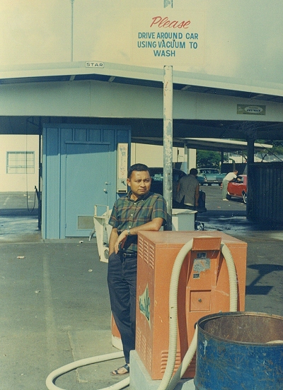 Sign at car wash reads 'Please Drive Around Car Using Vacuum to Wash'