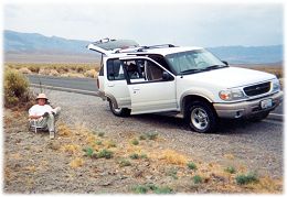 Harold waiting in a lawn chair outside the support vehicle