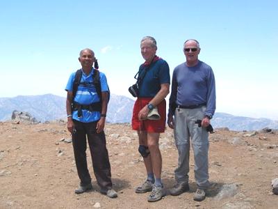 Dinesh, Ron, and Chuck on the broad summit