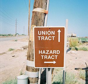 A sign offering a choice between 'Union Tract', straight ahead, and 'Hazard Tract', to the right